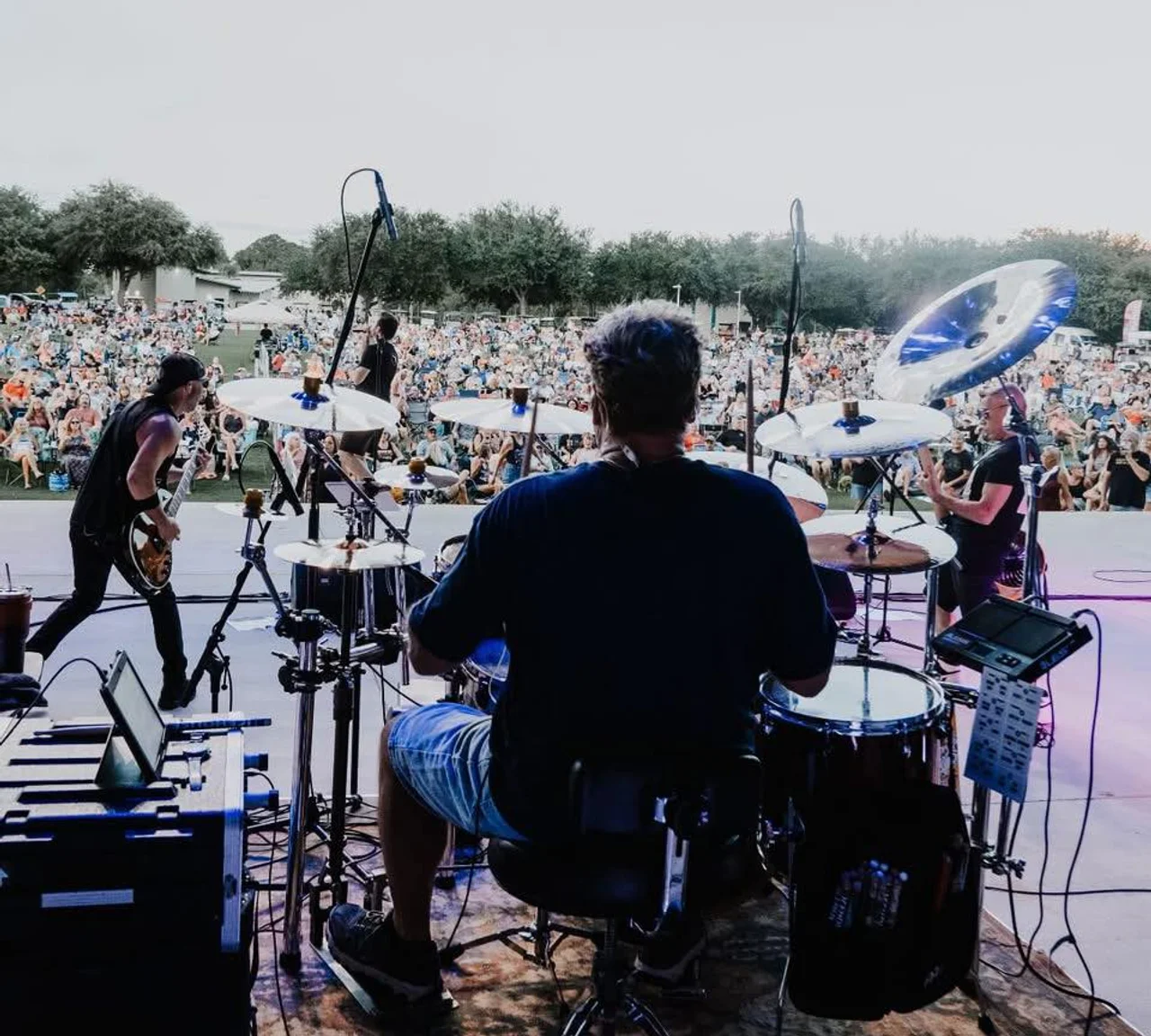 Sons of Saints performing to a massive outdoor crowd at the PCB Summer Concert Series