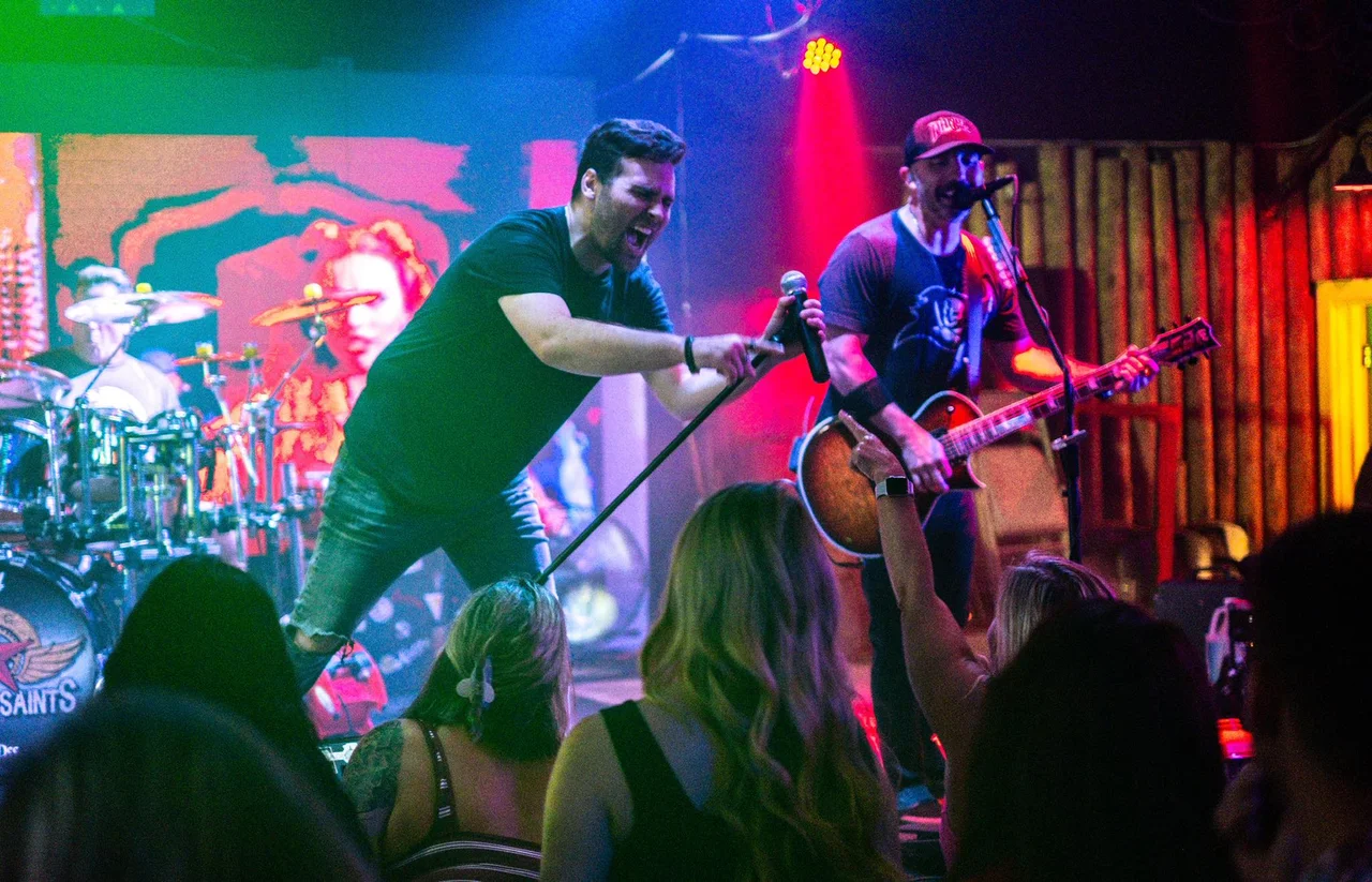 Sons of Saints performing live — indoor stage energy